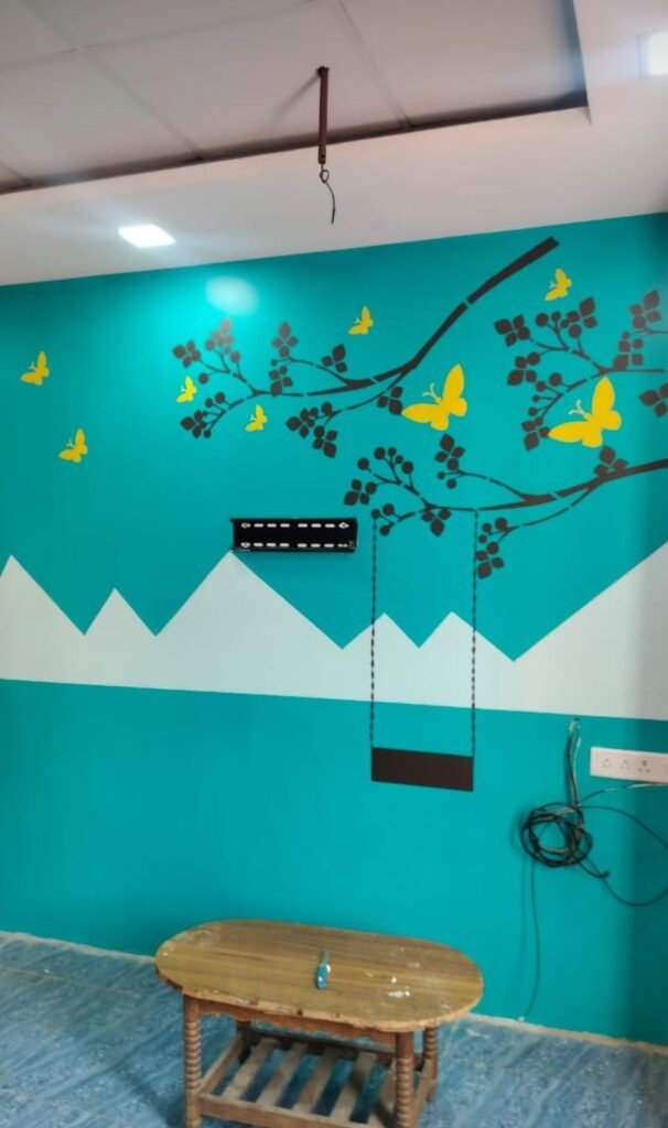 Teal feature wall with tree mural by Evolve Decors, Chennai