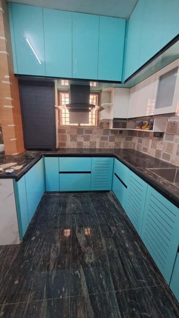 Aqua U-shaped modular kitchen by Evolve Decors, Chennai