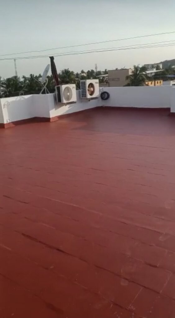 Terrace waterproofing with red coating by Evolve Decors, Chennai